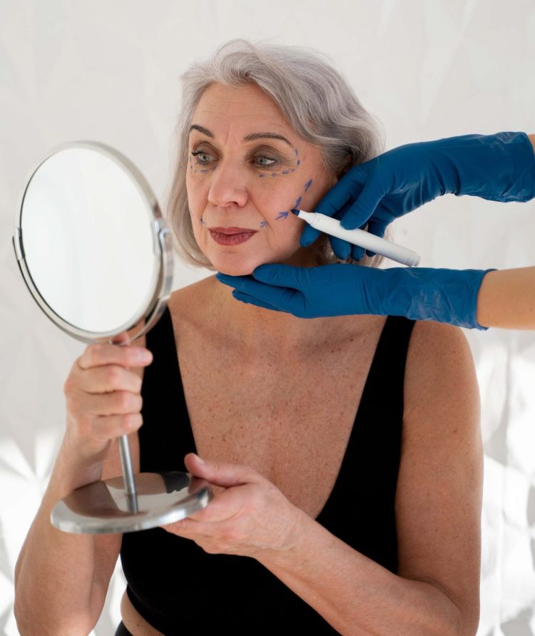 side-view-senior-woman-looking-mirror (1)